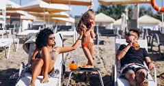 Family on the beach of the hotel Ribera Resort & SPA
