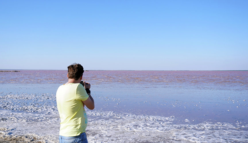 Photographer on the lake Sasyk-Sivash
