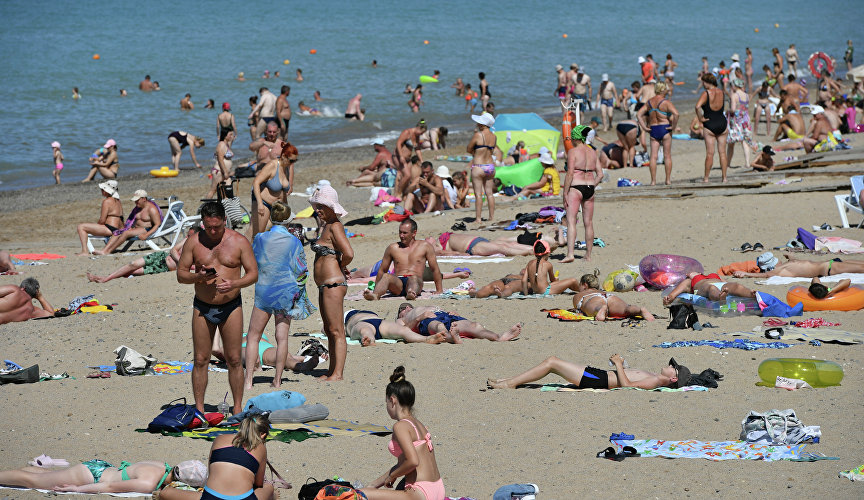 Vacationers on the beach in Saki