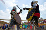 Festival guests taking part in a knights’ tournament